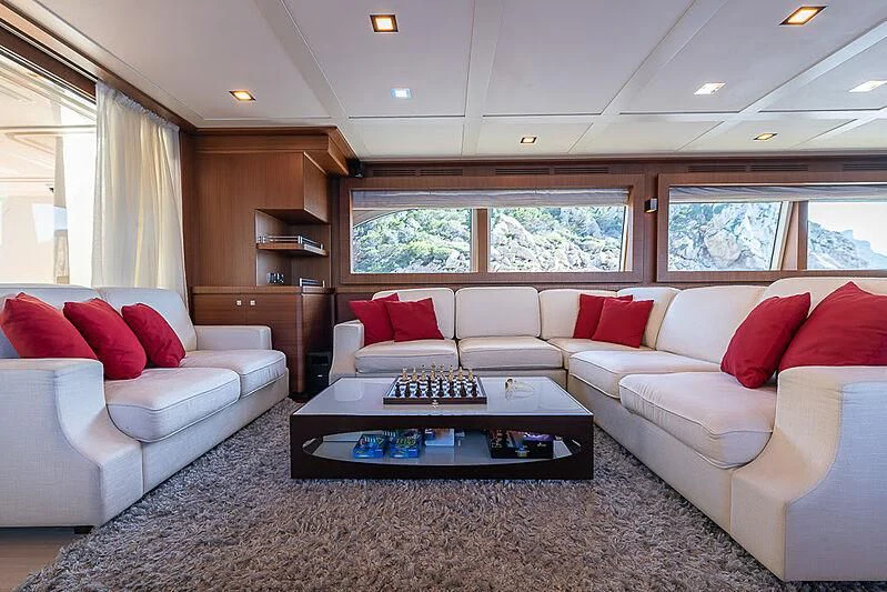 a living room with white couches aboard BLUE LINE Yacht for Sale