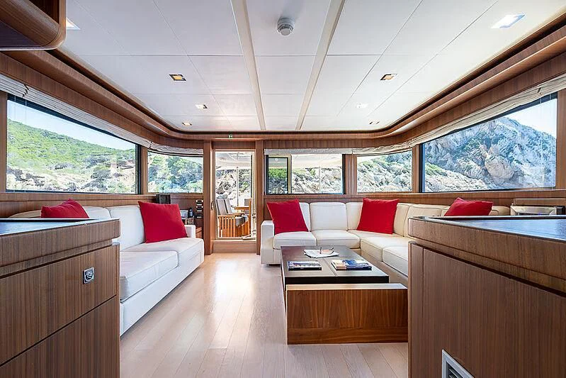 a living room with a couch and a coffee table aboard BLUE LINE Yacht for Sale