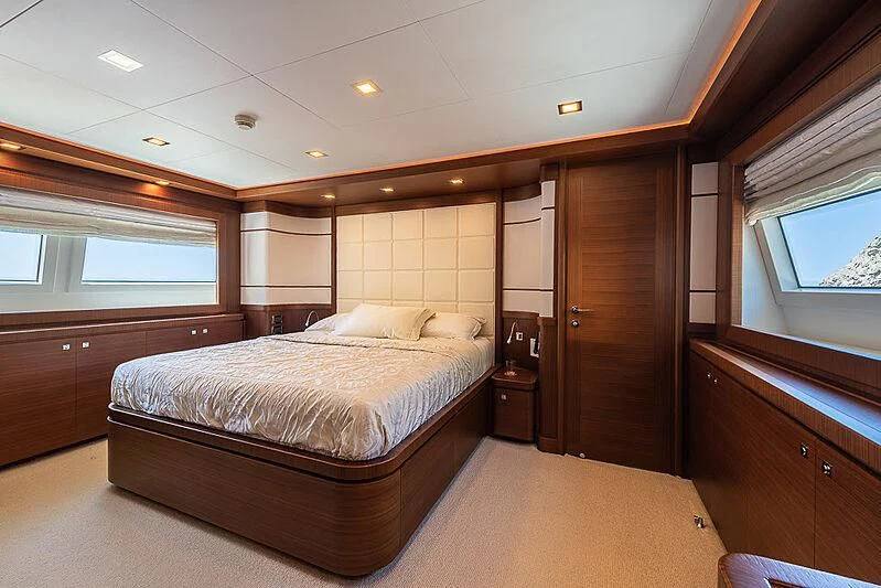 a room with a bed and a window aboard BLUE LINE Yacht for Sale