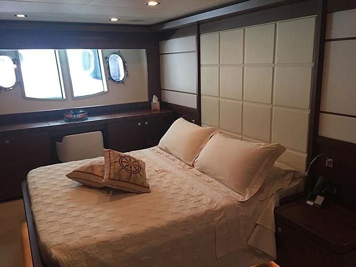 a bed with a pillow on it aboard BLUE LINE Yacht for Sale