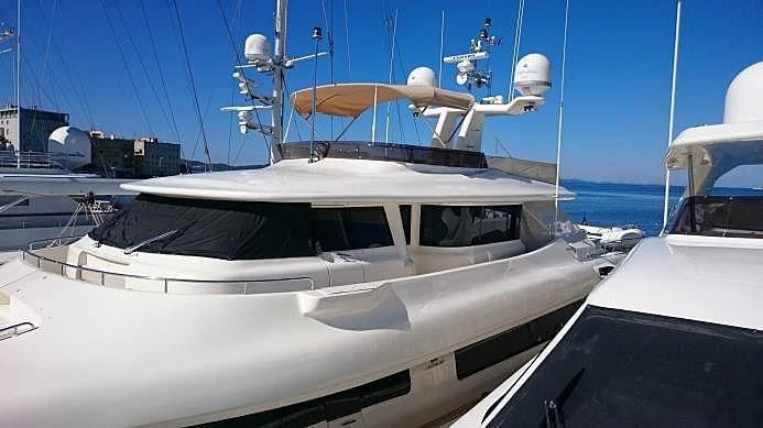 a boat docked at a pier aboard BLUE LINE Yacht for Sale