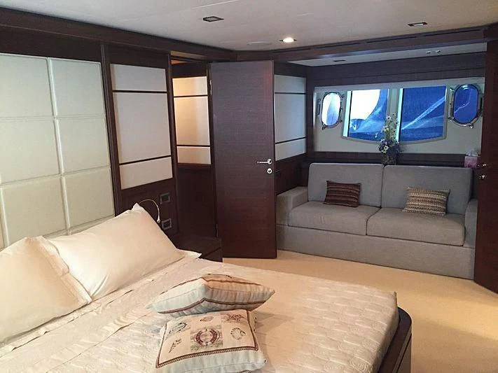 a room with a couch and a television aboard BLUE LINE Yacht for Sale