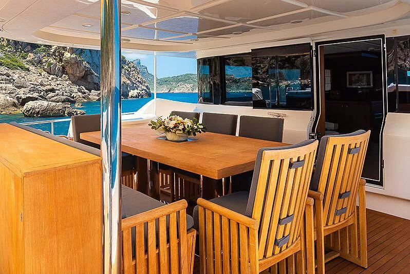 a table with chairs around it aboard BLUE LINE Yacht for Sale