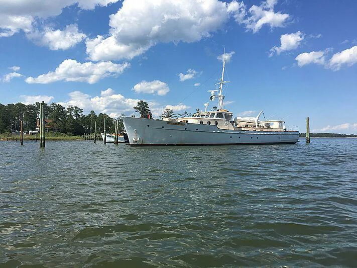a large white boat in the water aboard LION'S WHELP Yacht for Sale