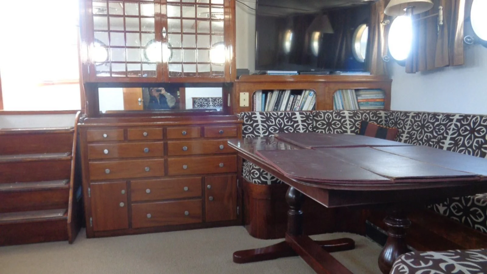 a room with a desk and a bed aboard LION'S WHELP Yacht for Sale