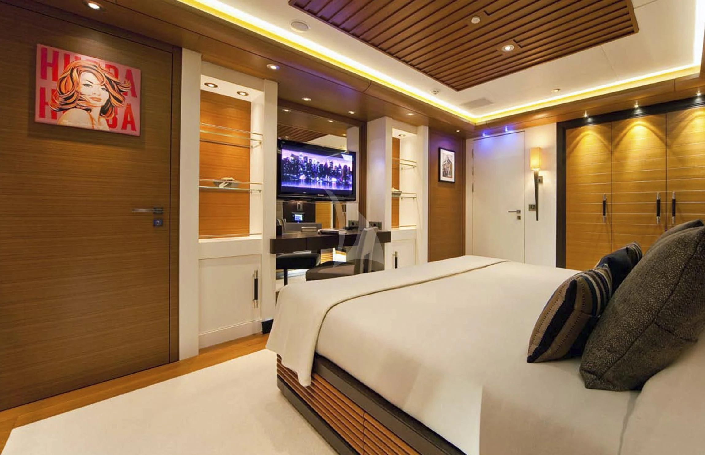 a room with a bed and a tv on the wall aboard MARY-JEAN II Yacht for Sale