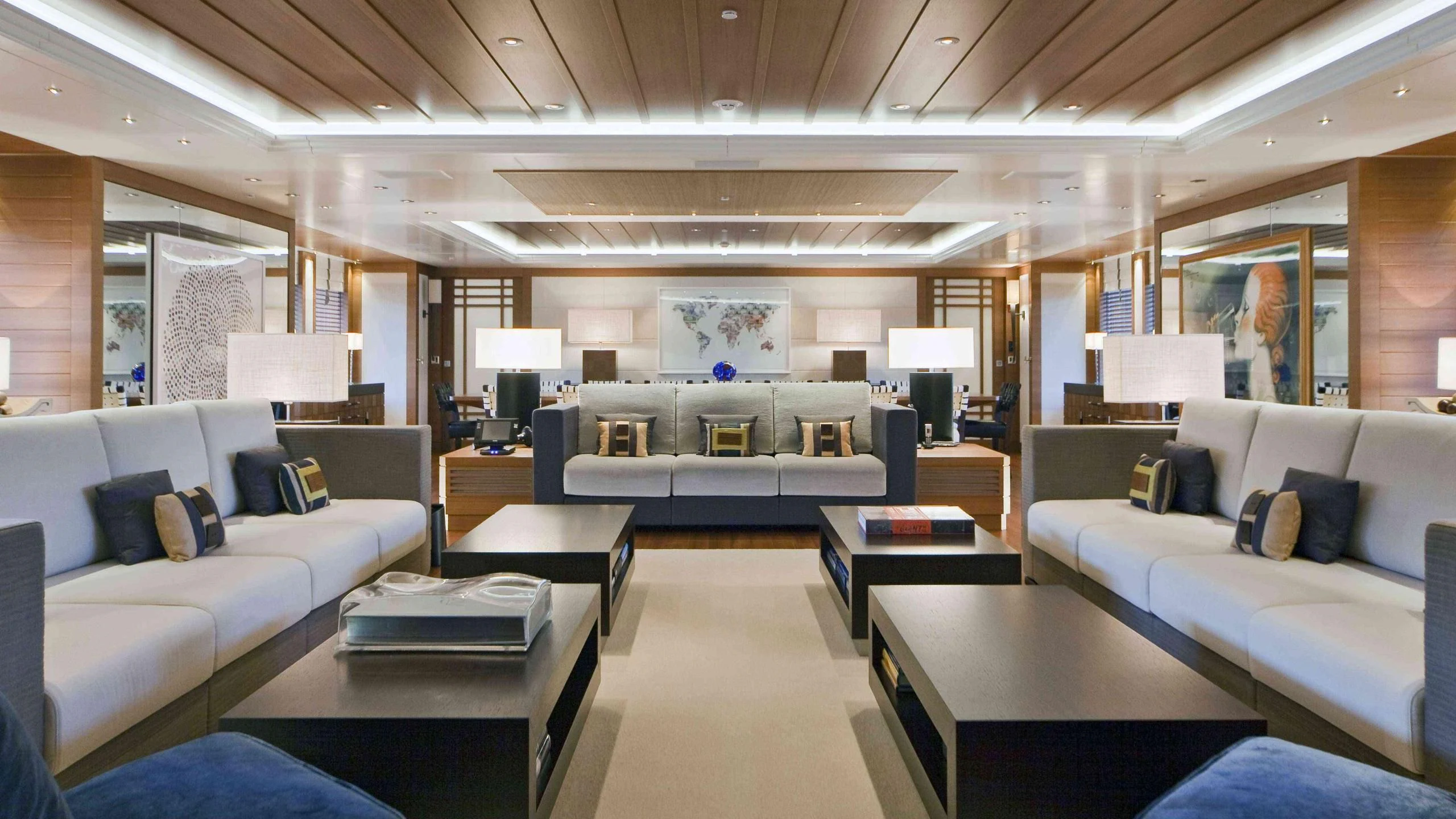 a large living room with a large couch and a table aboard MARY-JEAN II Yacht for Sale