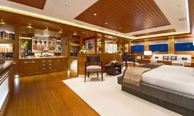 a room with a bed and a chair aboard MARY-JEAN II Yacht for Sale