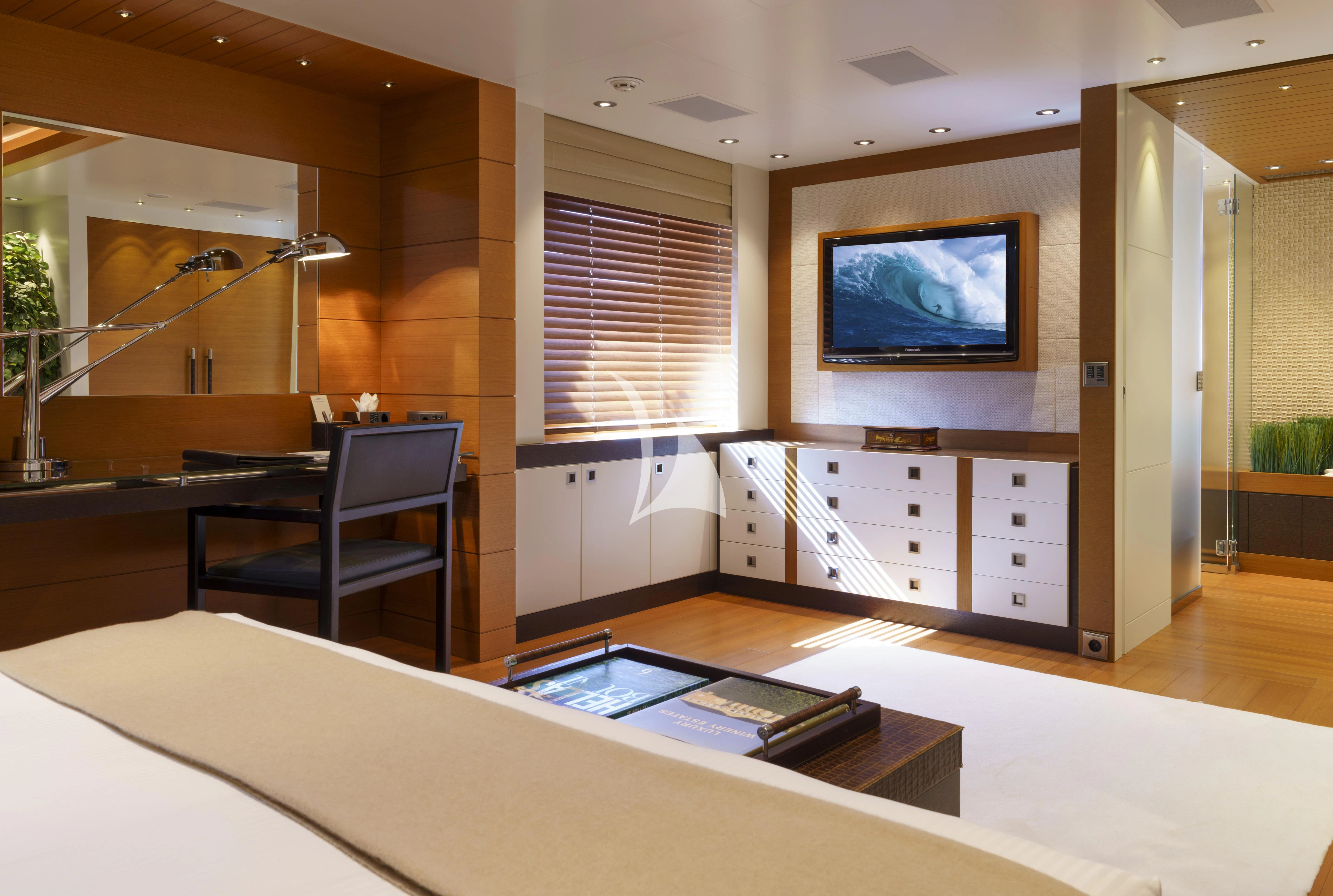 a room with a tv and a table aboard MARY-JEAN II Yacht for Sale