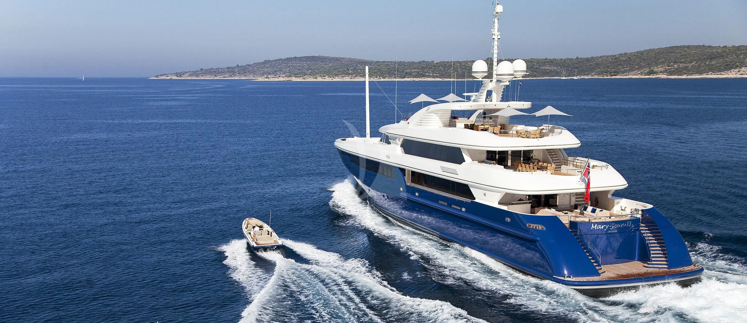 a large white boat on the water aboard MARY-JEAN II Yacht for Sale