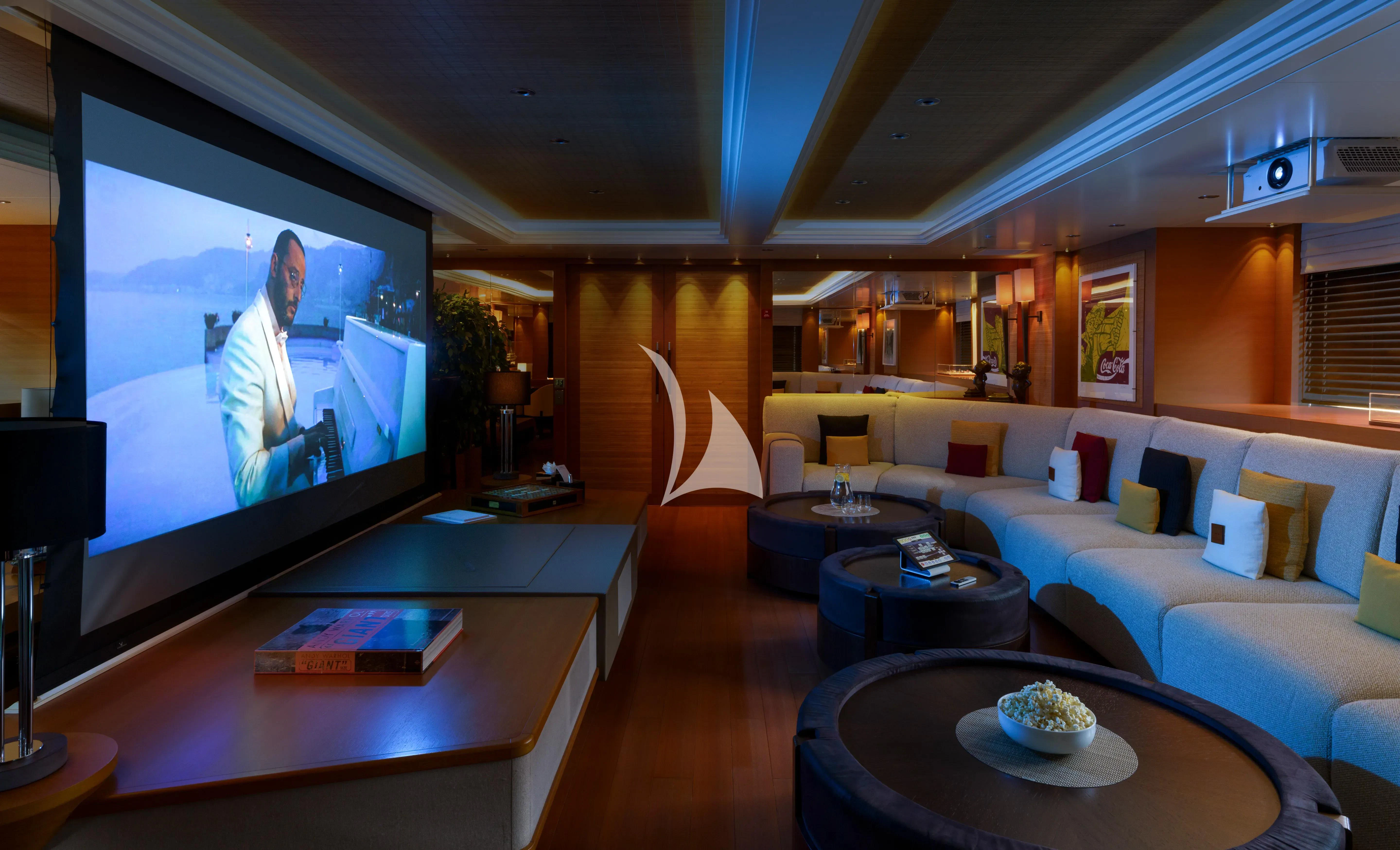 a living room with a large screen aboard MARY-JEAN II Yacht for Sale
