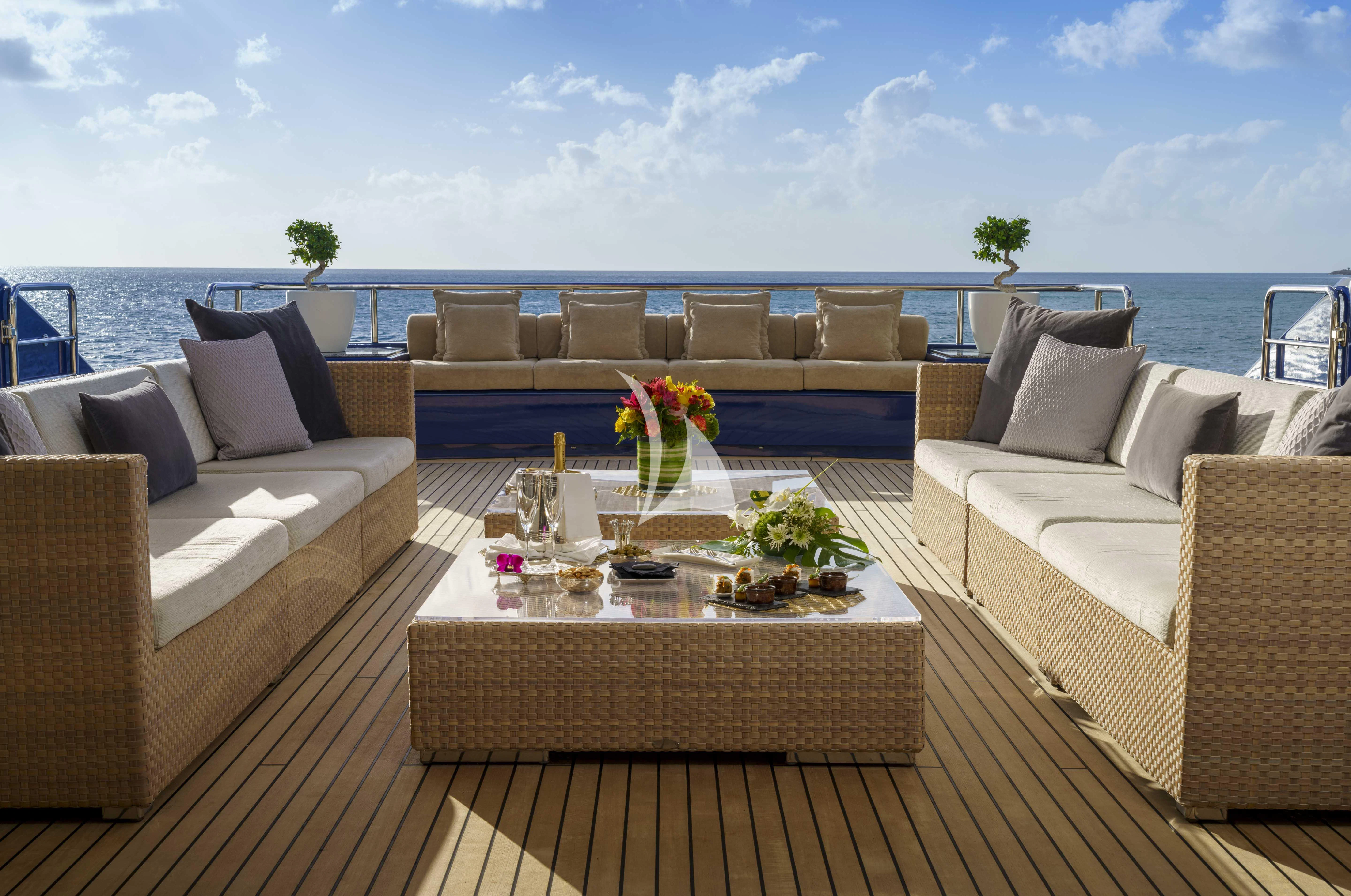 a patio with a table and chairs aboard MARY-JEAN II Yacht for Sale