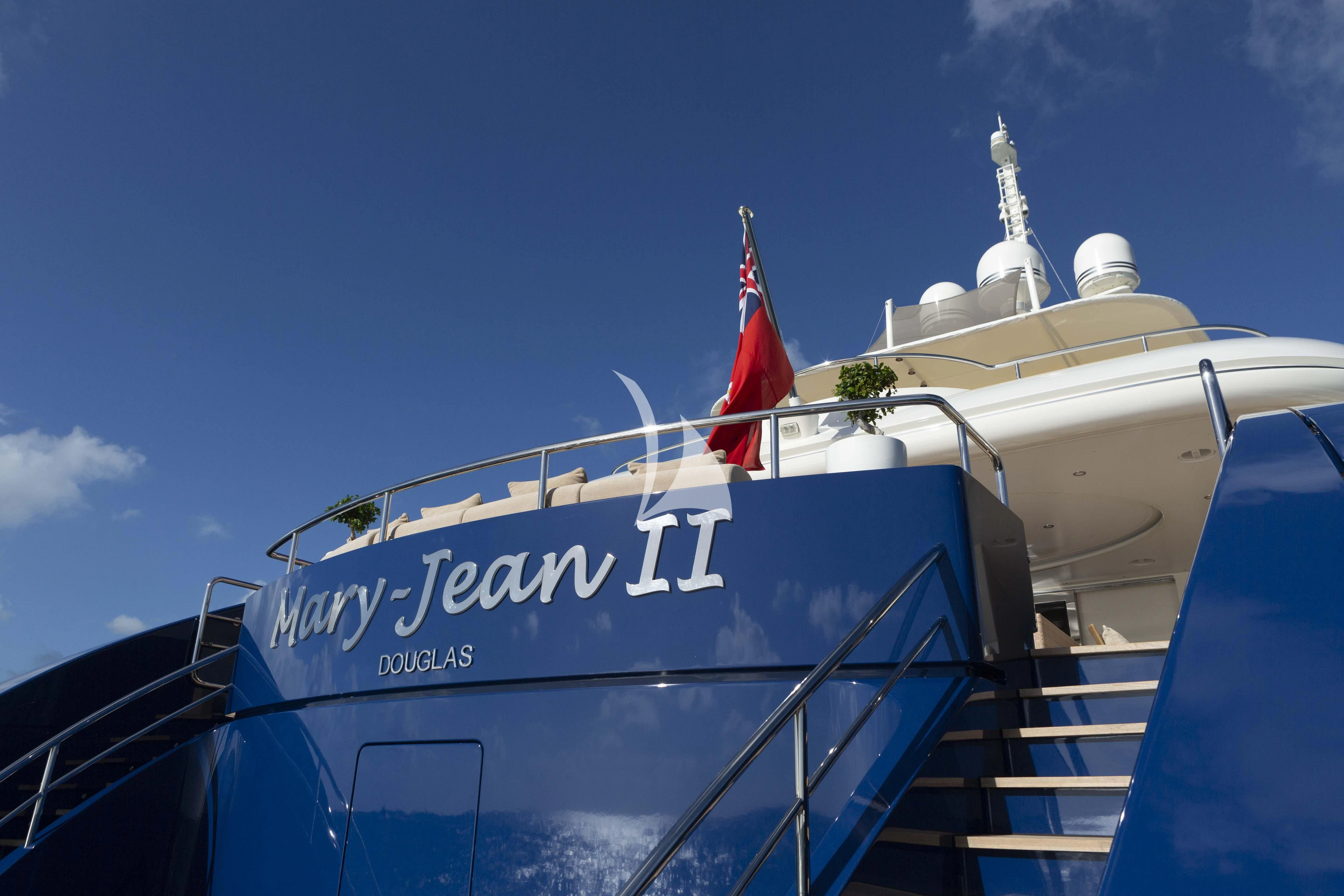 a large boat with a flag on it aboard MARY-JEAN II Yacht for Sale