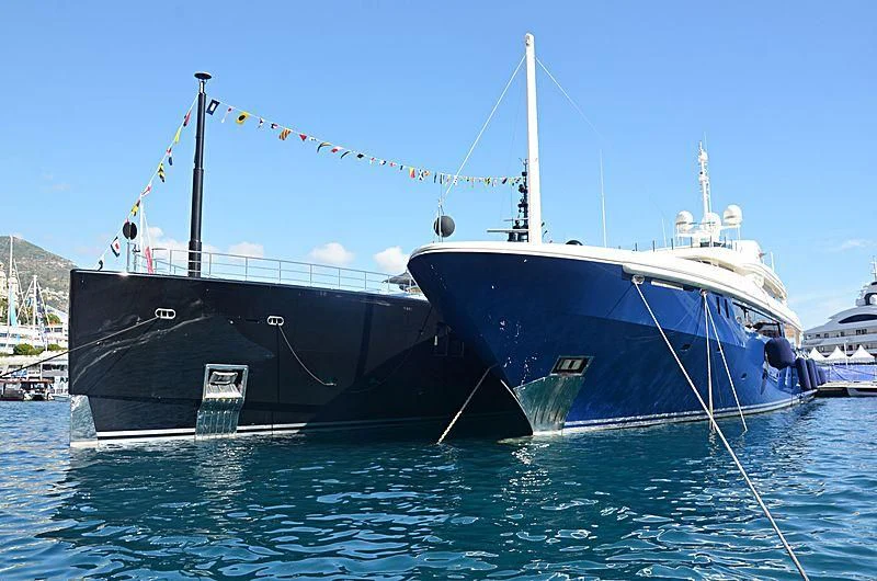 a couple of large boats are parked in the water aboard MARY-JEAN II Yacht for Sale