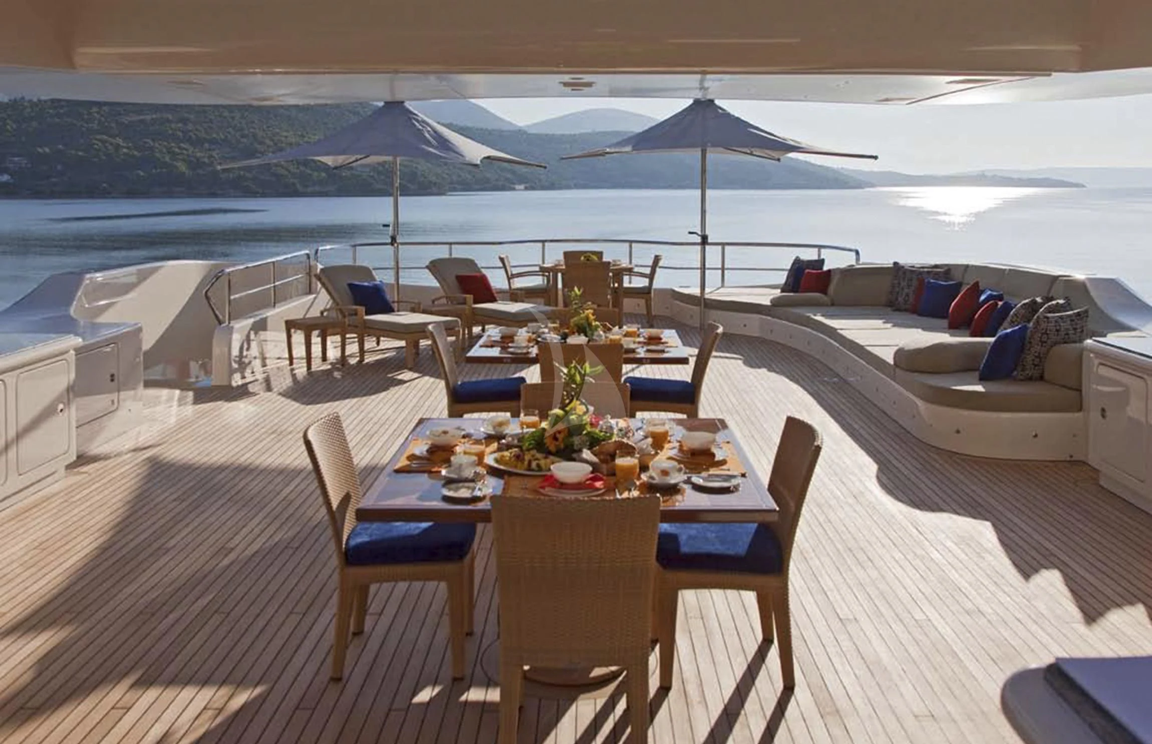 a table and chairs on a deck aboard MARY-JEAN II Yacht for Sale