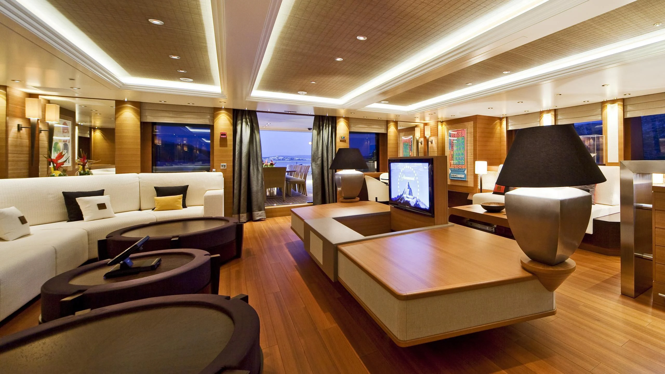 a room with a large table and chairs and a tv aboard MARY-JEAN II Yacht for Sale
