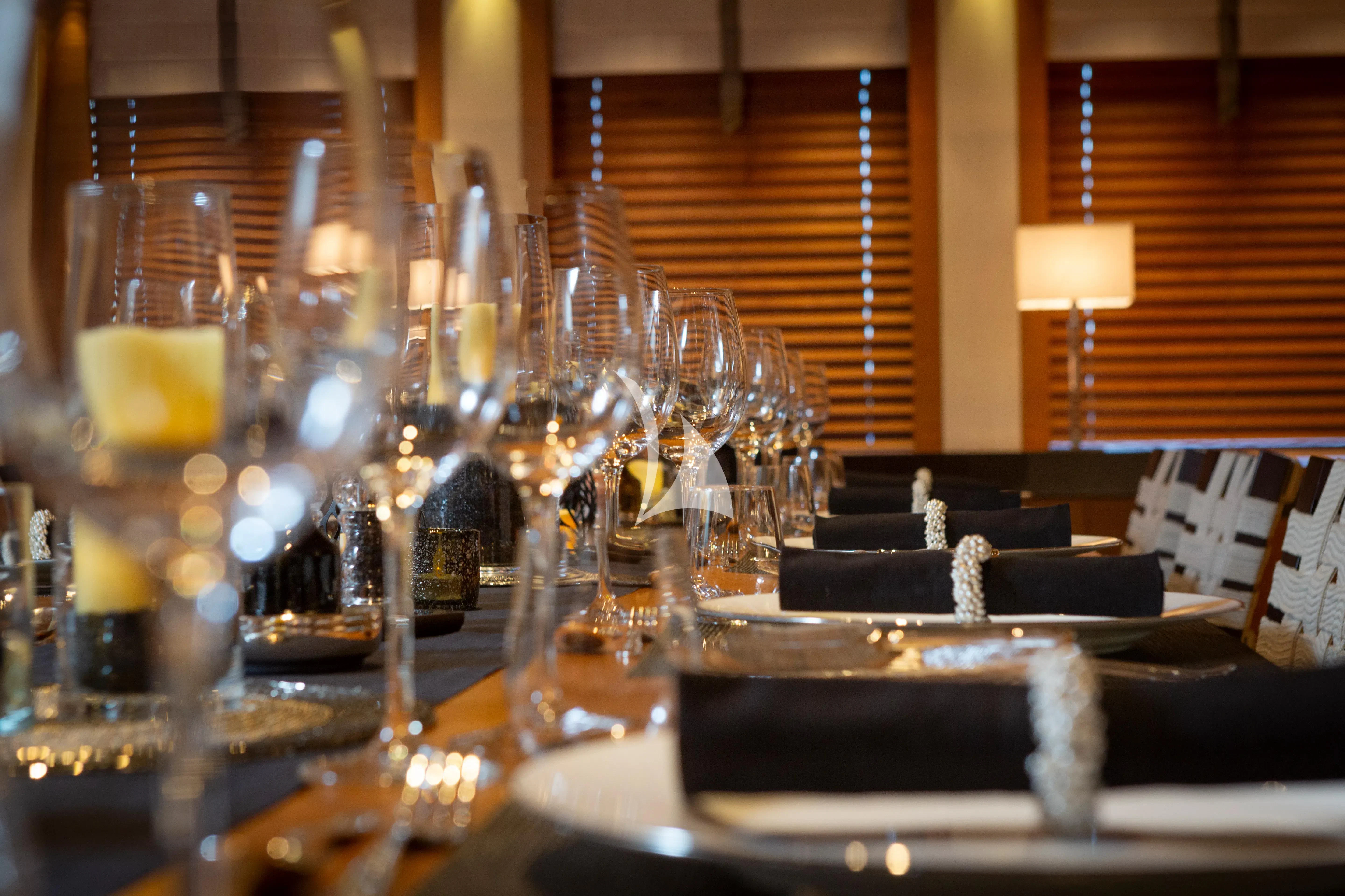 a table with wine glasses aboard MARY-JEAN II Yacht for Sale