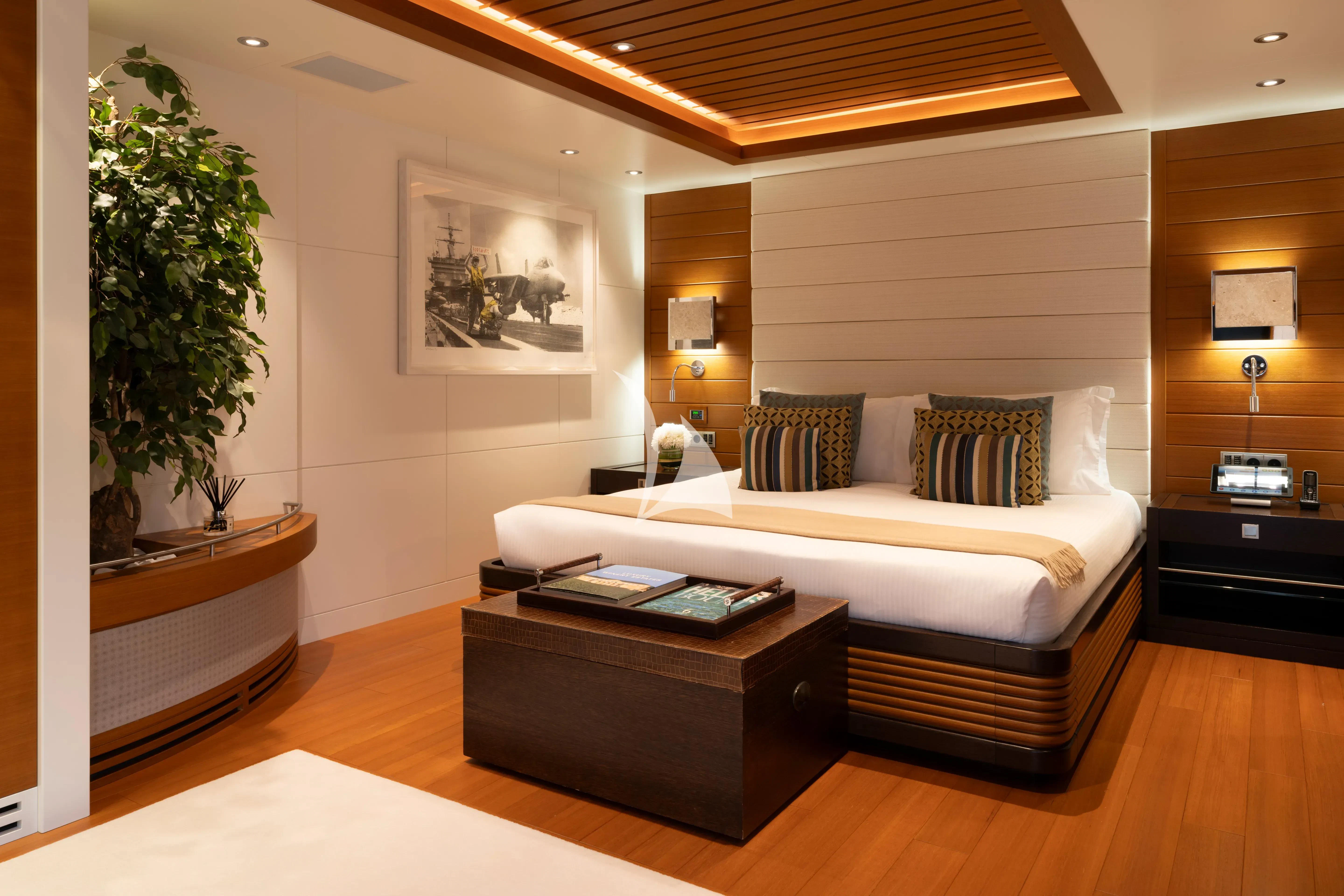 a bedroom with a bed and a desk aboard MARY-JEAN II Yacht for Sale