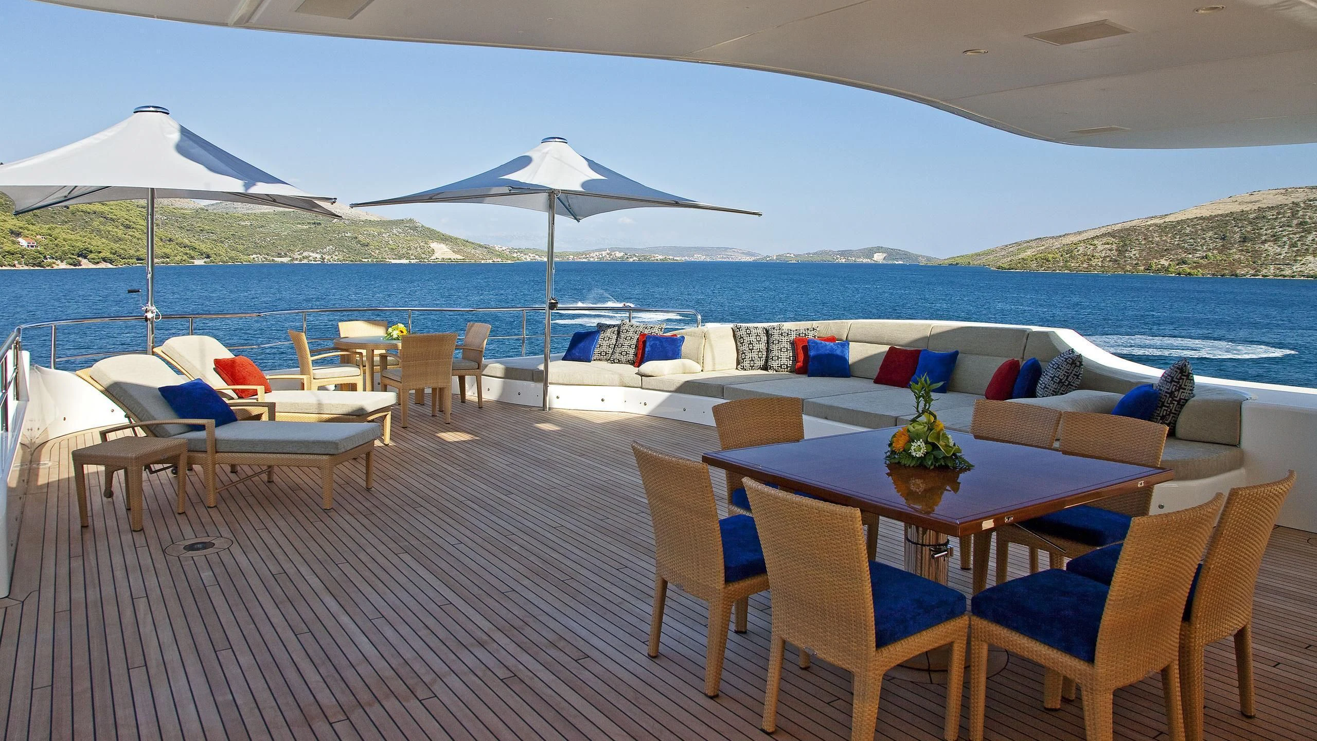 a table and chairs on a patio aboard MARY-JEAN II Yacht for Sale