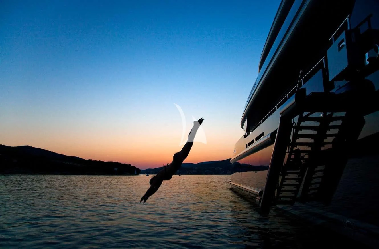 a person jumping into a boat aboard MARY-JEAN II Yacht for Sale