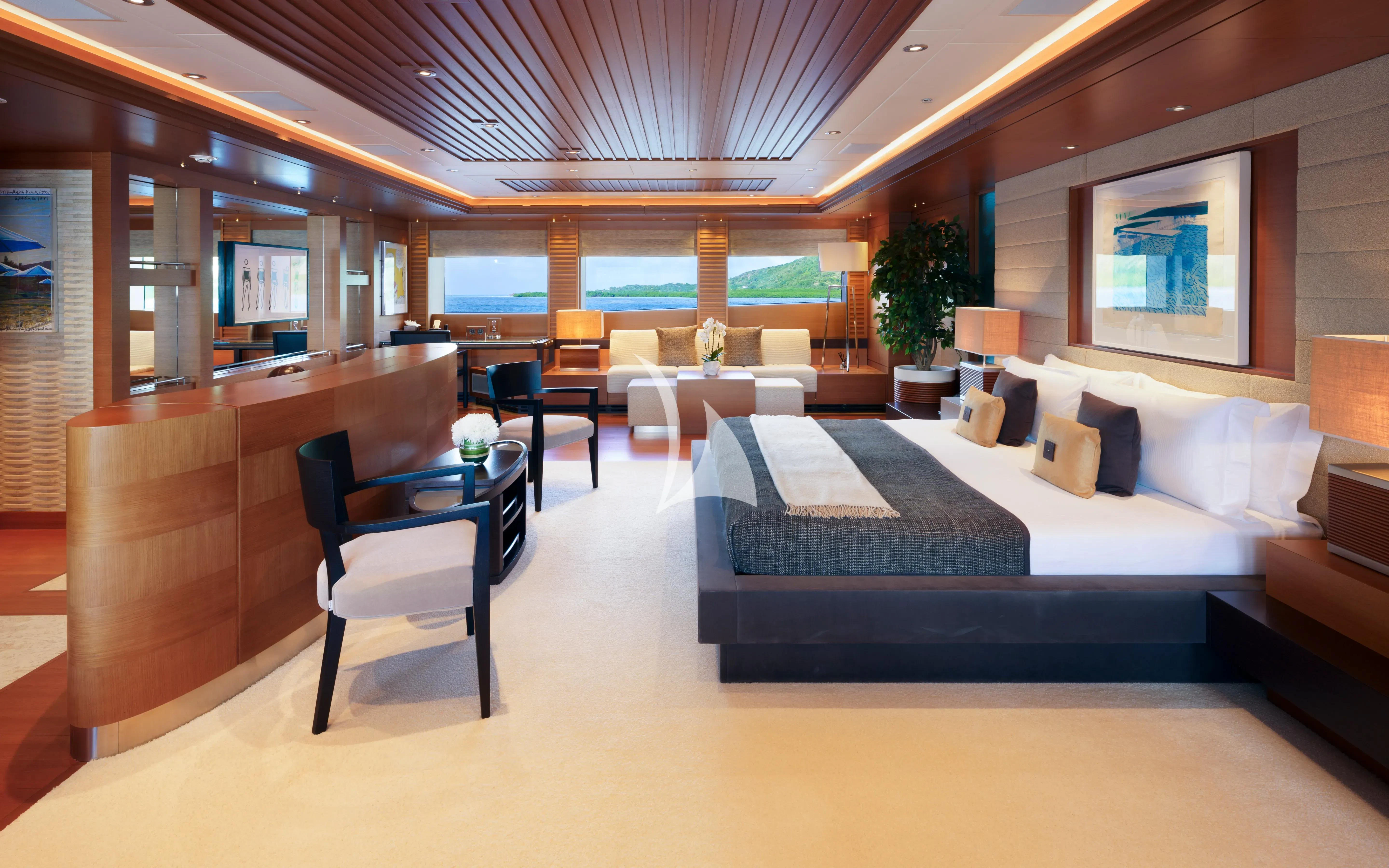 a large hotel room with a bed and desk aboard MARY-JEAN II Yacht for Sale
