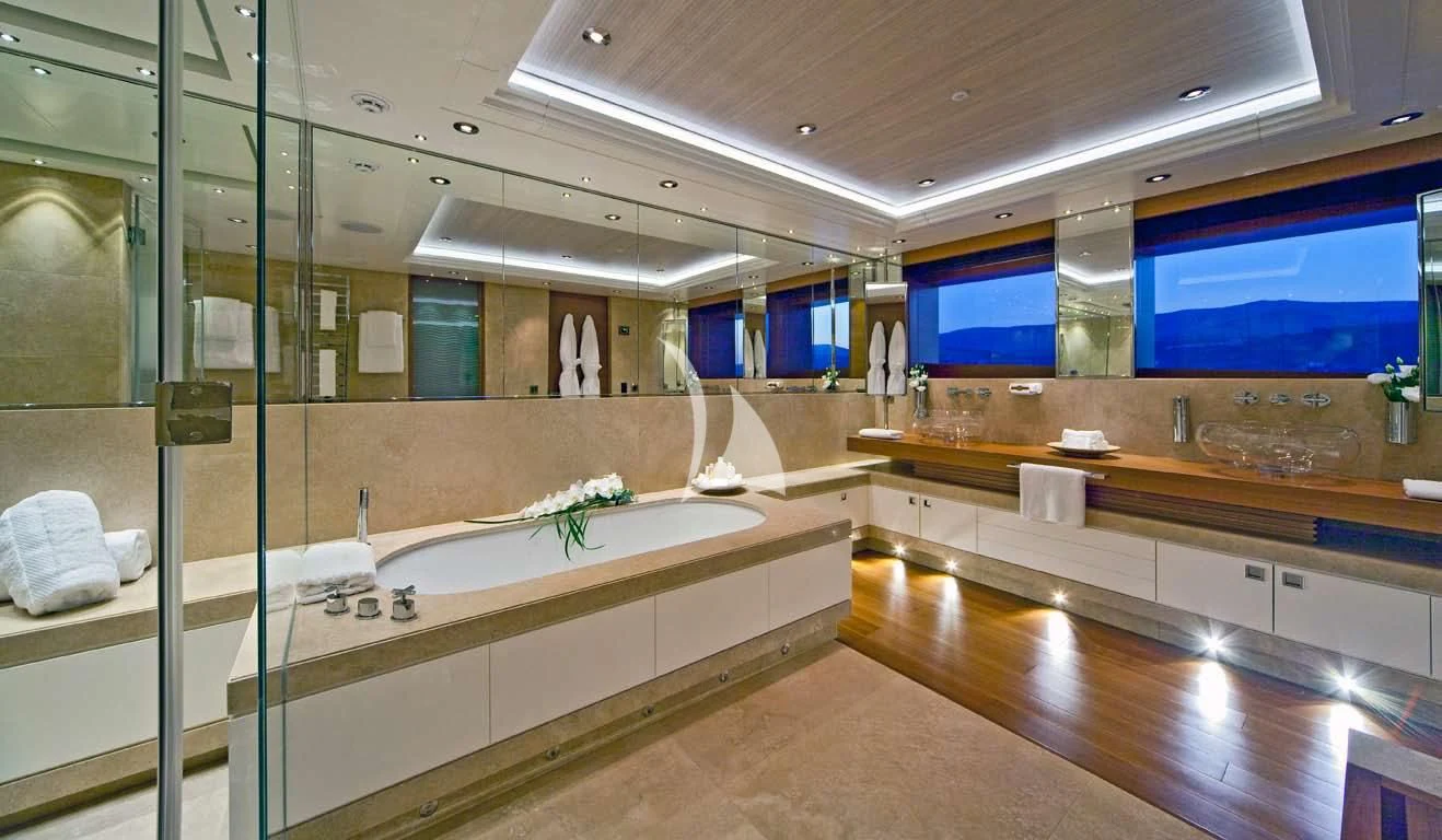 a bathroom with a large glass shower aboard MARY-JEAN II Yacht for Sale