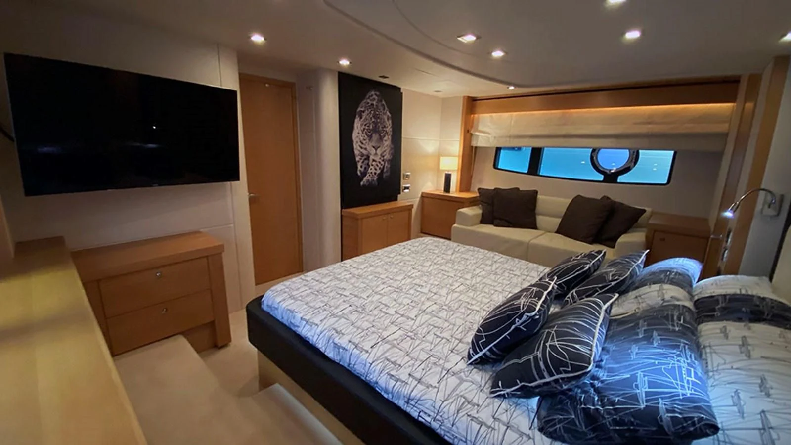 a large bed in a hotel room aboard LIO Yacht for Sale