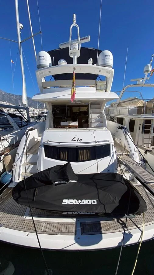 a boat docked at a pier aboard LIO Yacht for Sale