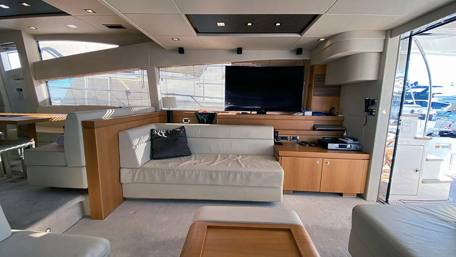 a living room with a couch and a tv aboard LIO Yacht for Sale