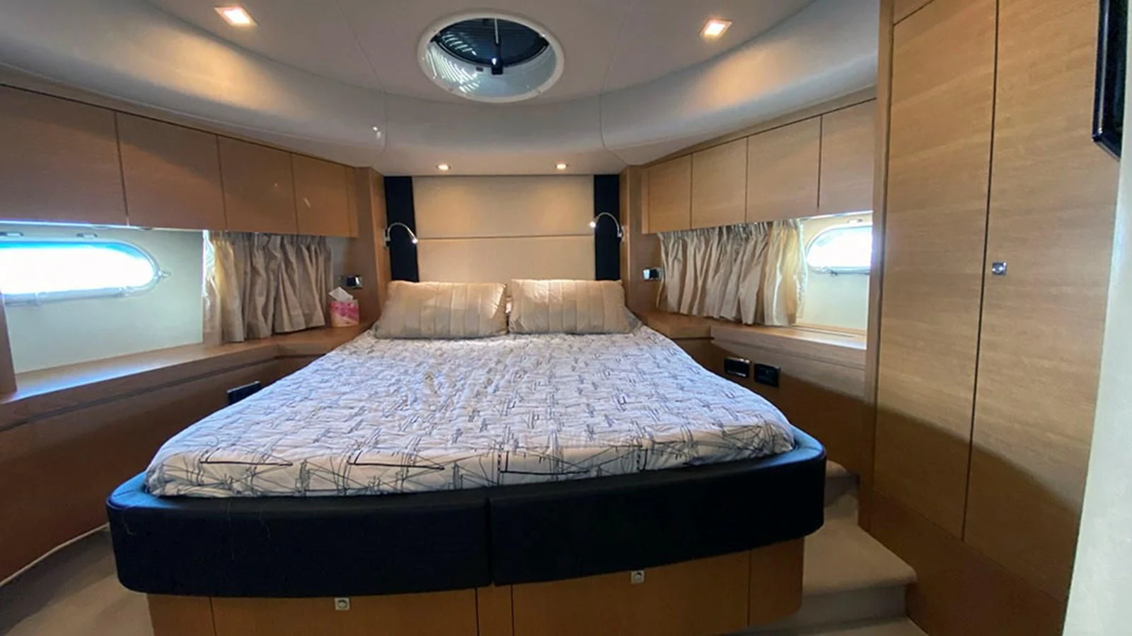 a bed in a room aboard LIO Yacht for Sale