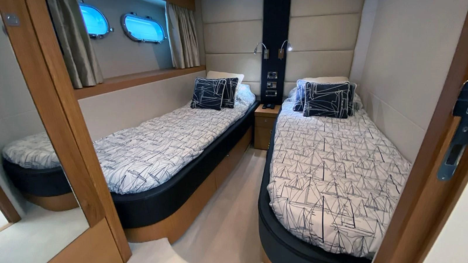 a couple of beds in a room aboard LIO Yacht for Sale