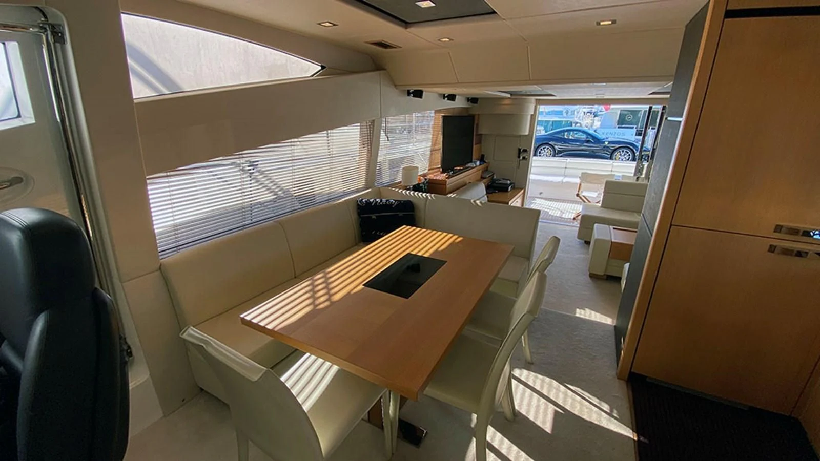 a room with a table and chairs aboard LIO Yacht for Sale