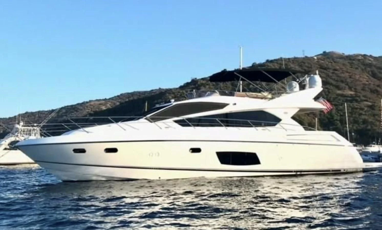 a white yacht on the water aboard LIO Yacht for Sale