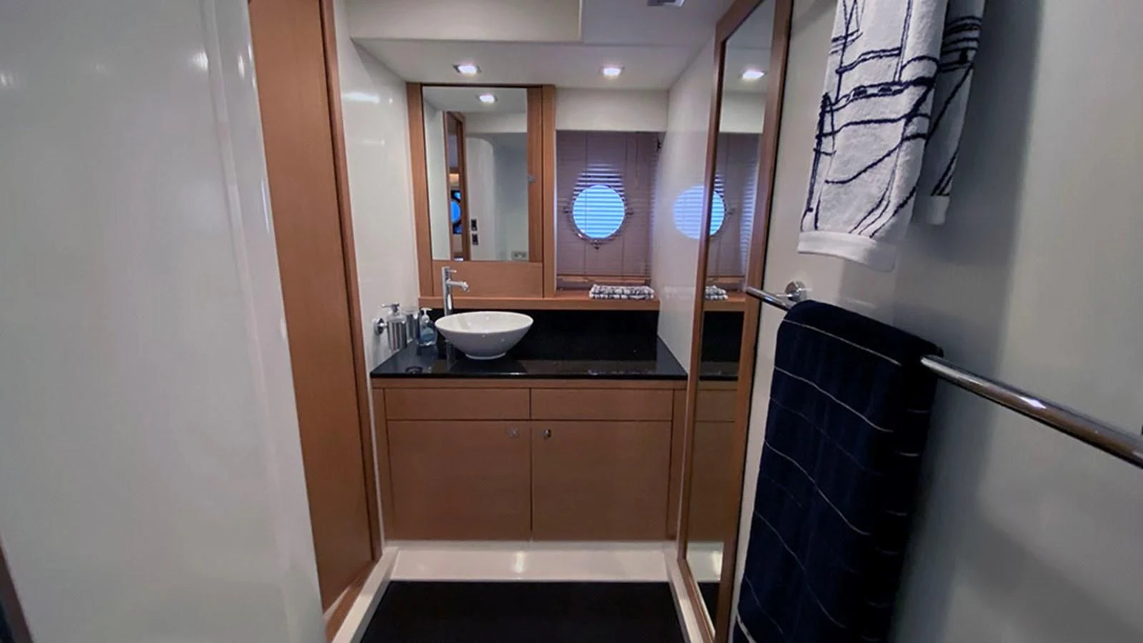 a bathroom with a sink and a mirror aboard LIO Yacht for Sale