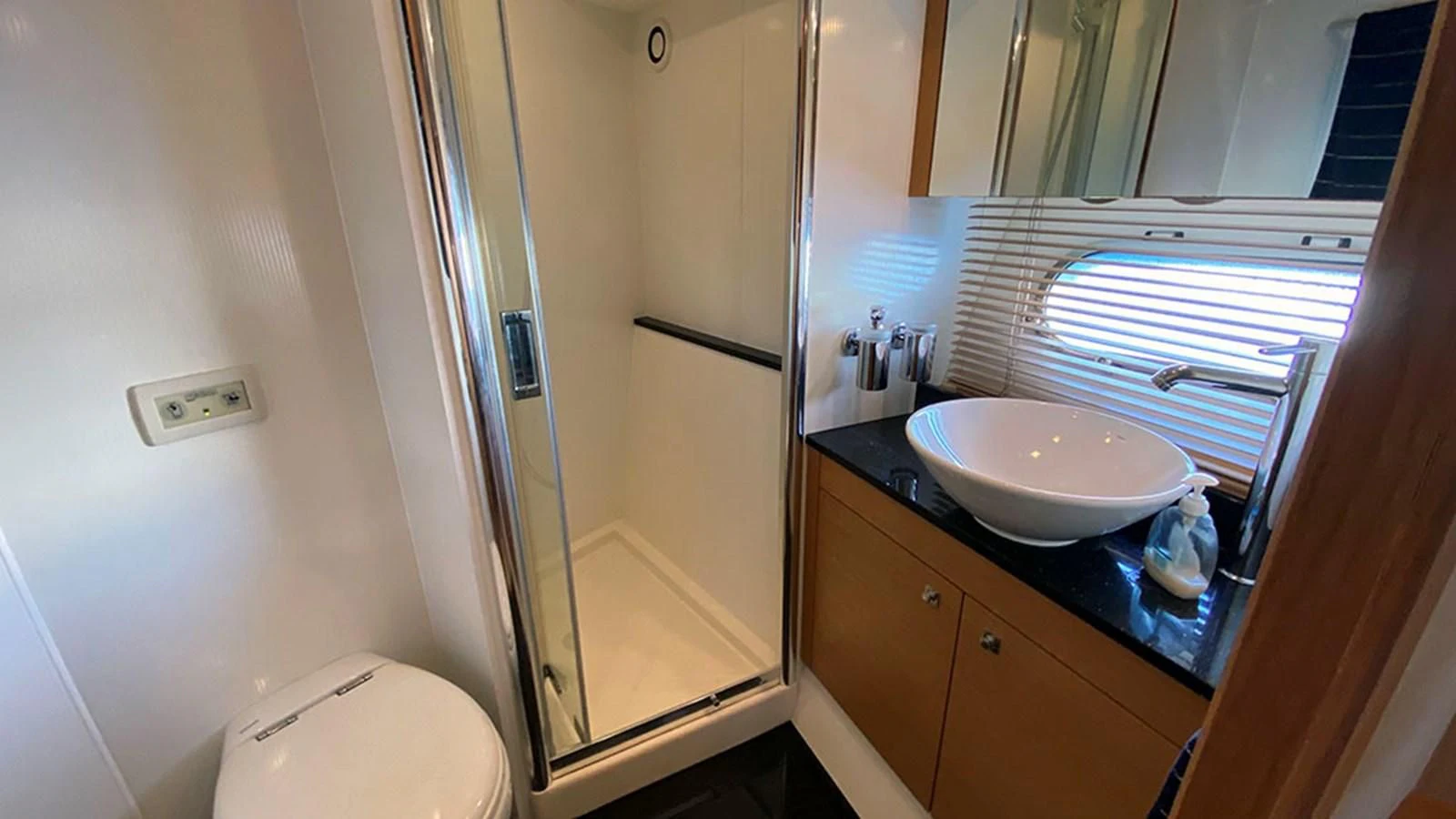 a bathroom with a sink and a mirror aboard LIO Yacht for Sale