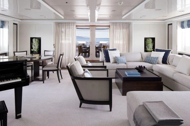 a living room with a piano and a couch aboard HOLDIN' MY OWN Yacht for Sale