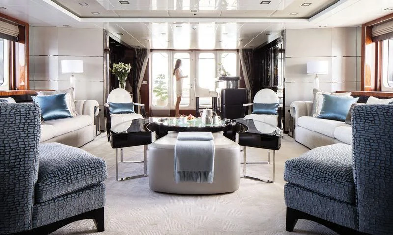 a room with a table chairs and a couch aboard HOLDIN' MY OWN Yacht for Sale