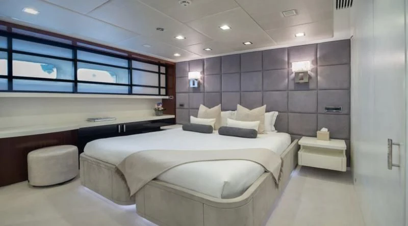 a room with a bed and a desk aboard HOLDIN' MY OWN Yacht for Sale
