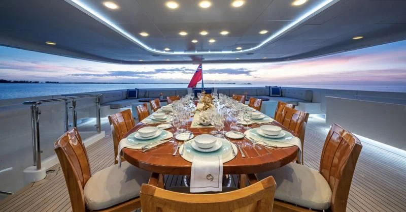 a dining table set for a dinner aboard HOLDIN' MY OWN Yacht for Sale