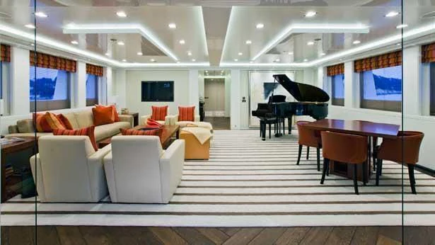 a large room with a table and chairs aboard HOLDIN' MY OWN Yacht for Sale