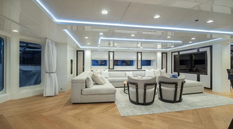 a large living room with a large window aboard HOLDIN' MY OWN Yacht for Sale