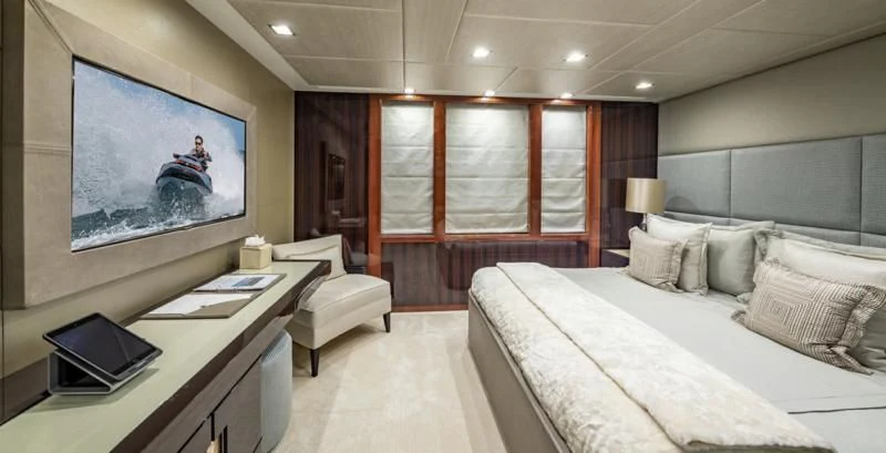 a room with a bed and a tv aboard HOLDIN' MY OWN Yacht for Sale