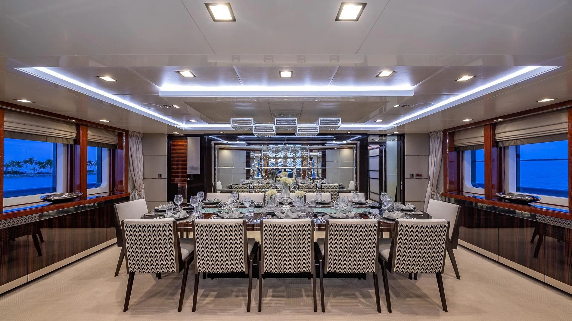 a large room with a table and chairs aboard HOLDIN' MY OWN Yacht for Sale