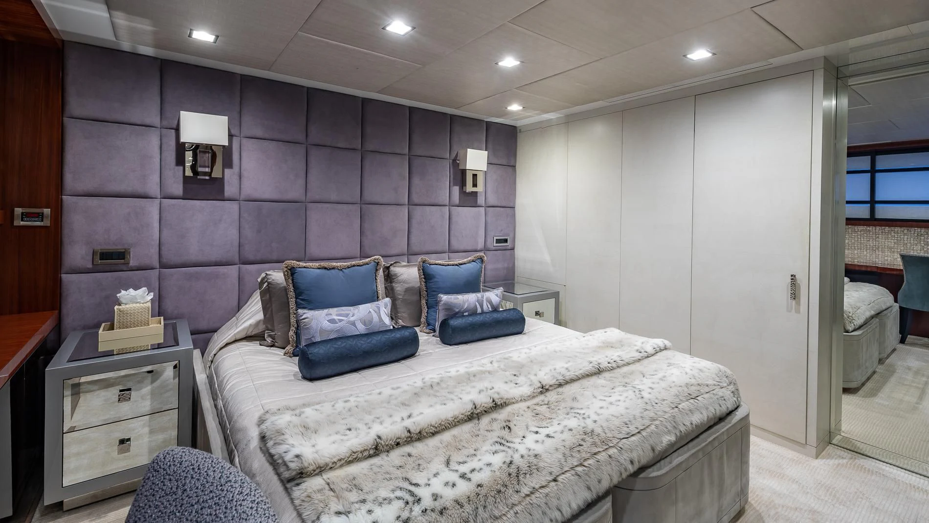 a bedroom with a bed and a dresser aboard HOLDIN' MY OWN Yacht for Sale