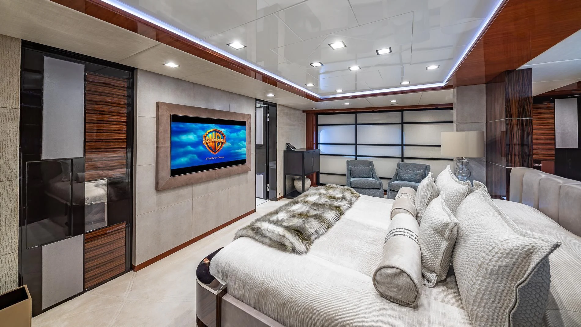 a living room with a large screen aboard HOLDIN' MY OWN Yacht for Sale