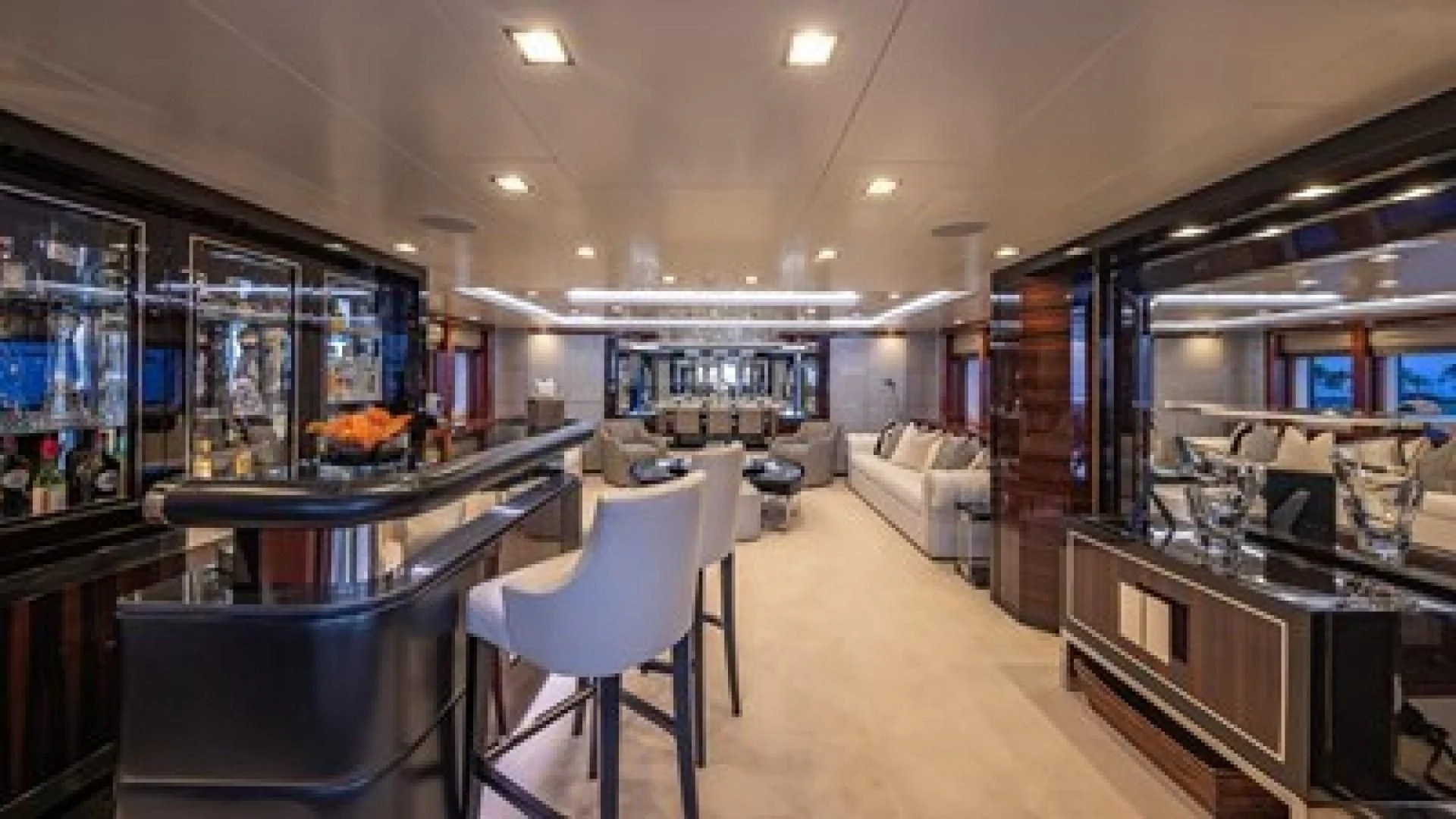 a large room with a table and chairs aboard HOLDIN' MY OWN Yacht for Sale