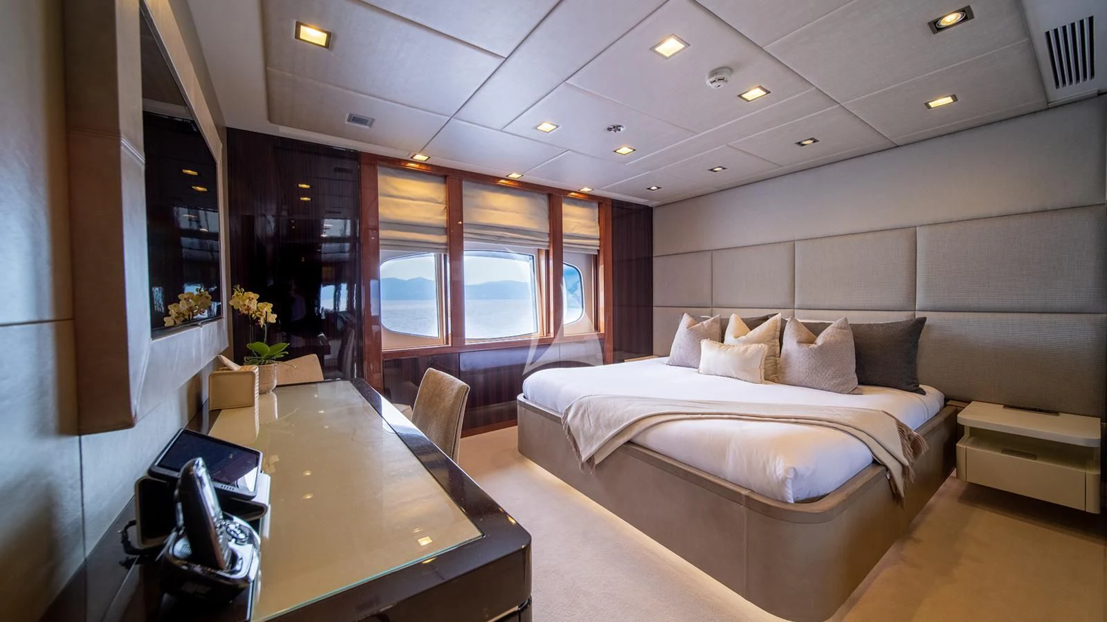 a room with a bed and desk aboard HOLDIN' MY OWN Yacht for Sale
