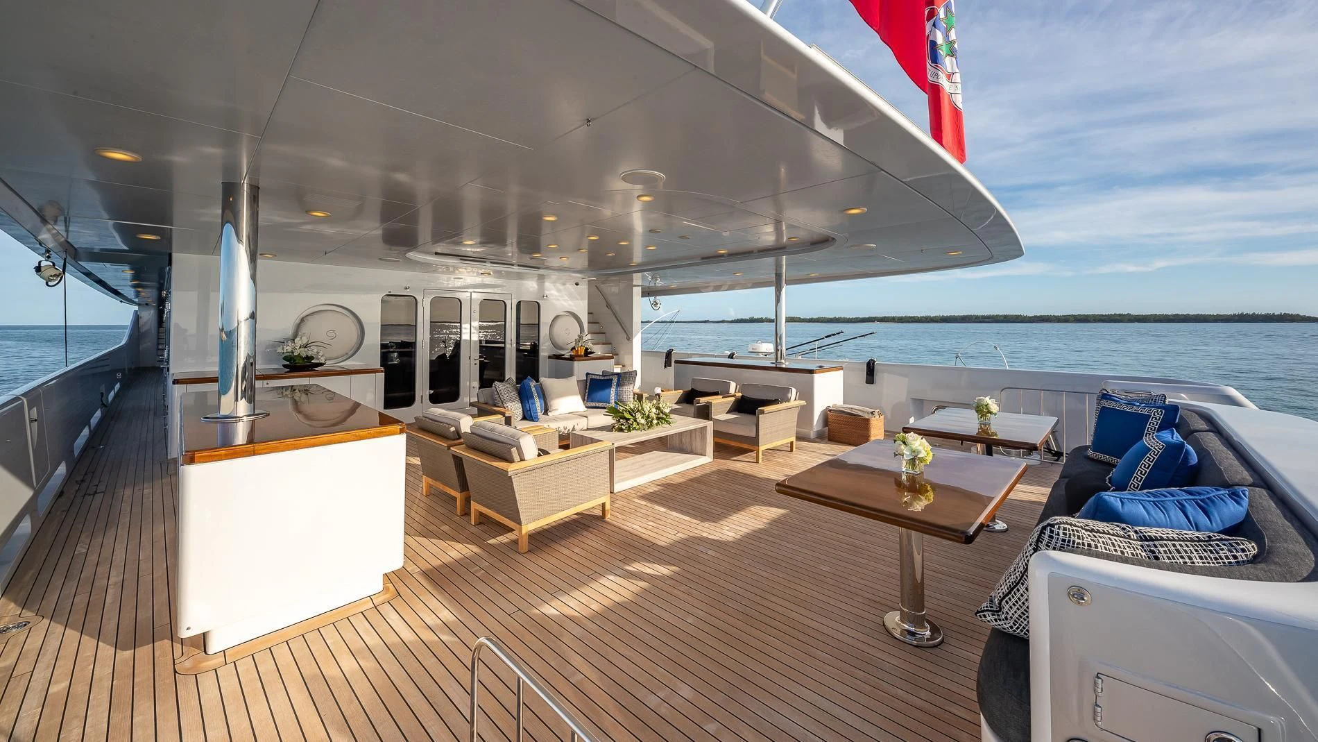 a large living room with a large balcony overlooking the ocean aboard HOLDIN' MY OWN Yacht for Sale