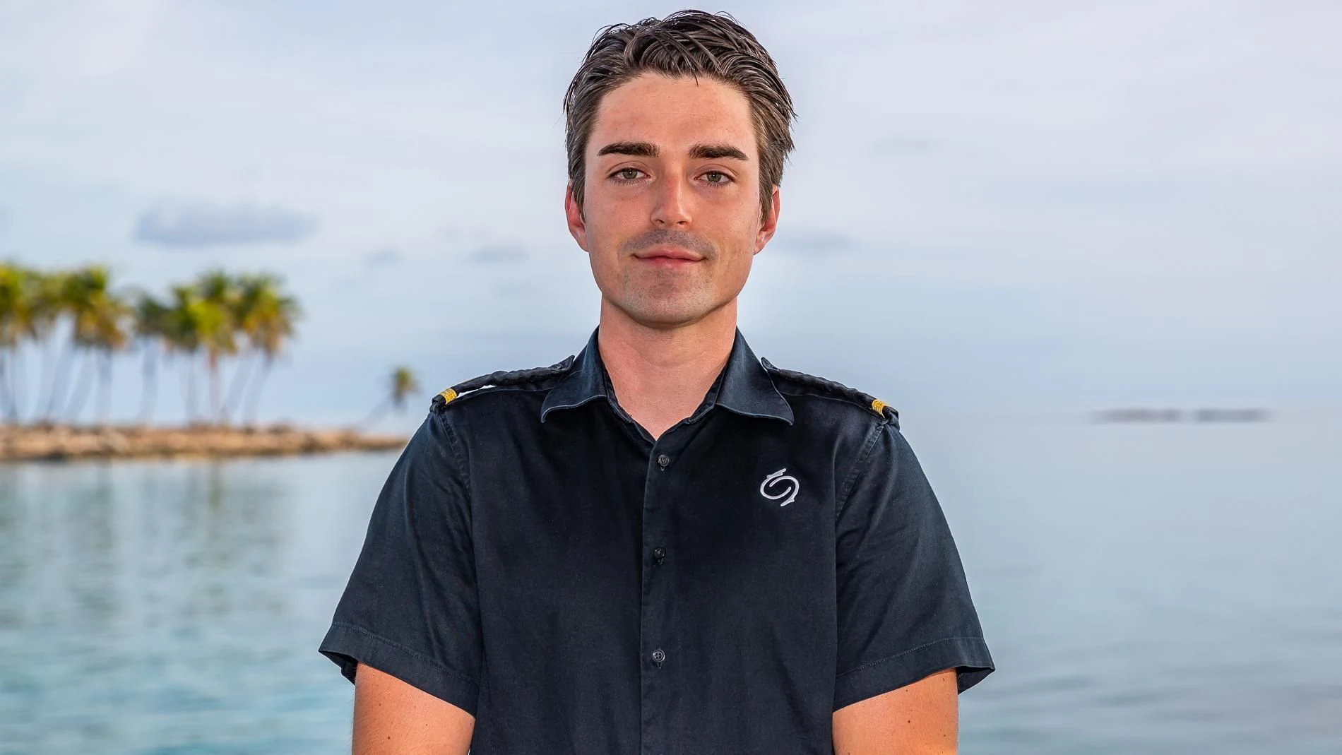 a man standing in front of a body of water aboard HOLDIN' MY OWN Yacht for Sale