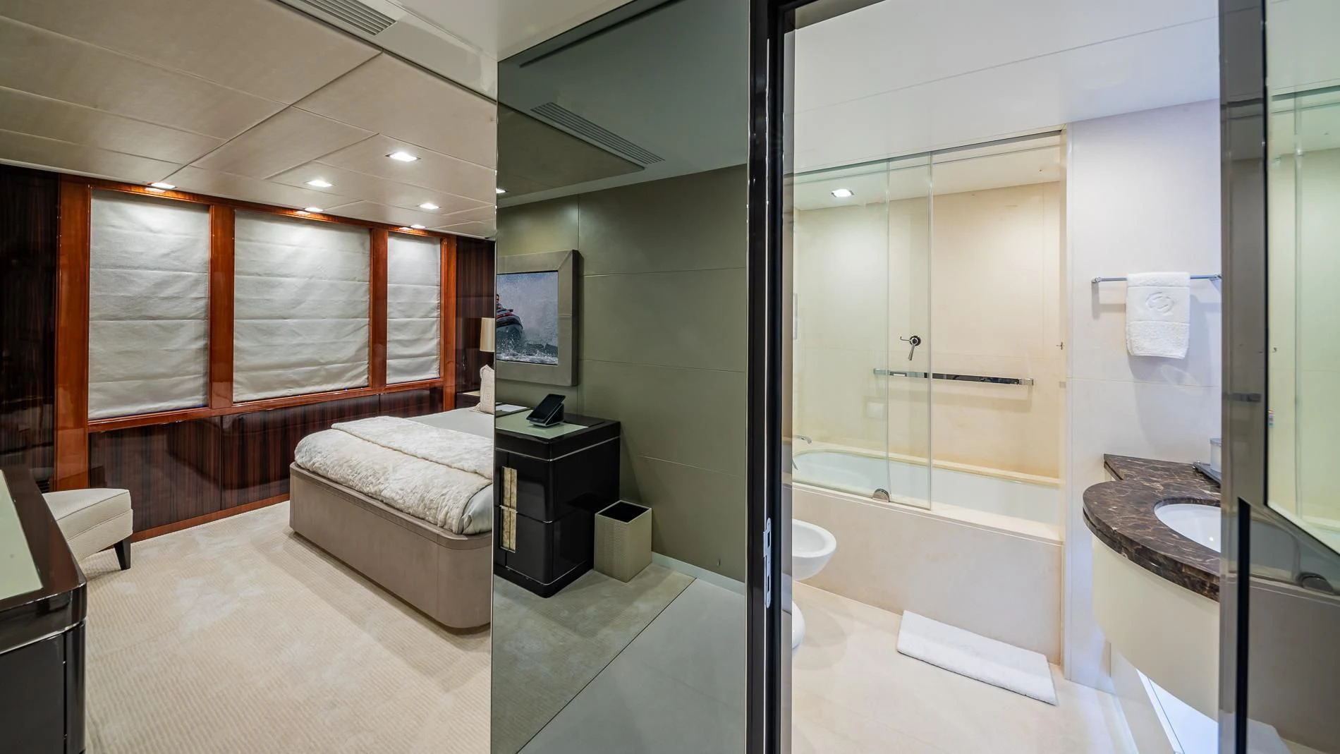 a bathroom with a tub sink and a mirror aboard HOLDIN' MY OWN Yacht for Sale